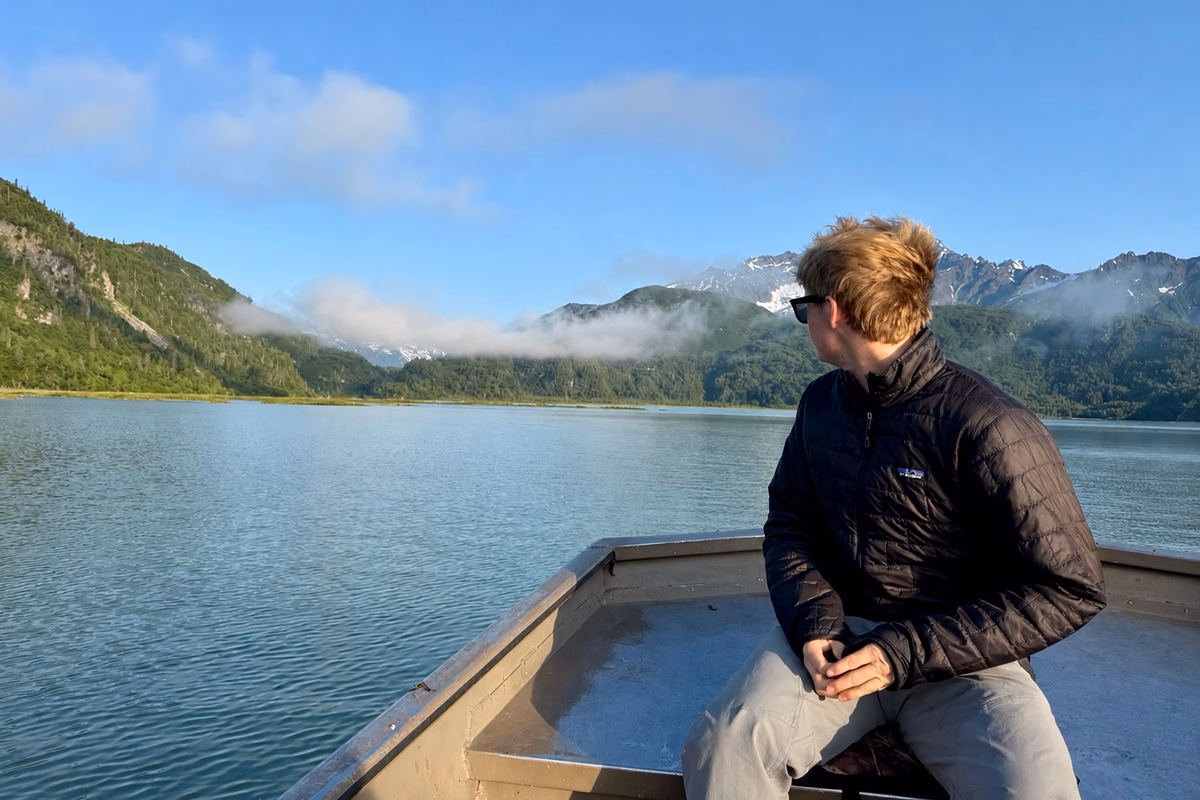 On a boat in Alaska, looking out at the mountains